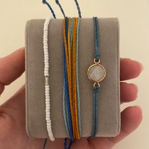 Set of 3 Pura Vida bracelets that are adjustable